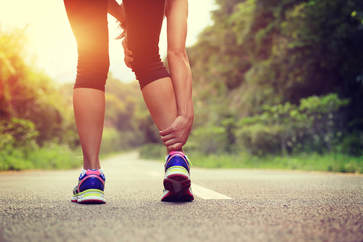 Runner's injured leg being examined